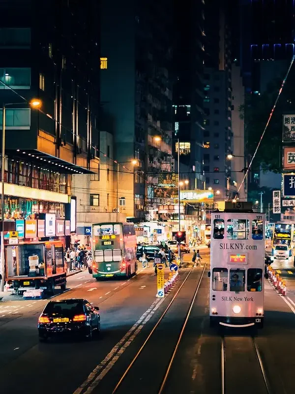 Trams on a Hong Kong street at night